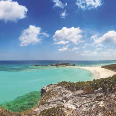 Dragon Cay at low tide viewed from the cliffs above, with the rocks mostly exposed. Mudjin Harbor, Middle Caicos