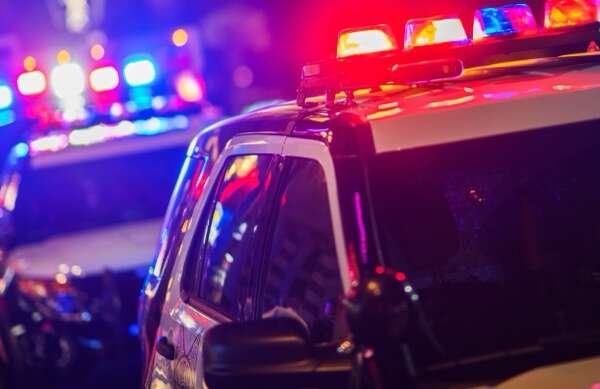 Night Time Police Violent Crime Intervention. Police Vehicles with Flashing Lights.